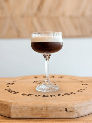 Espresso Martini made with Kvas Old Fashioned Simple Syrup on Kvas Fine Beverage wooden board