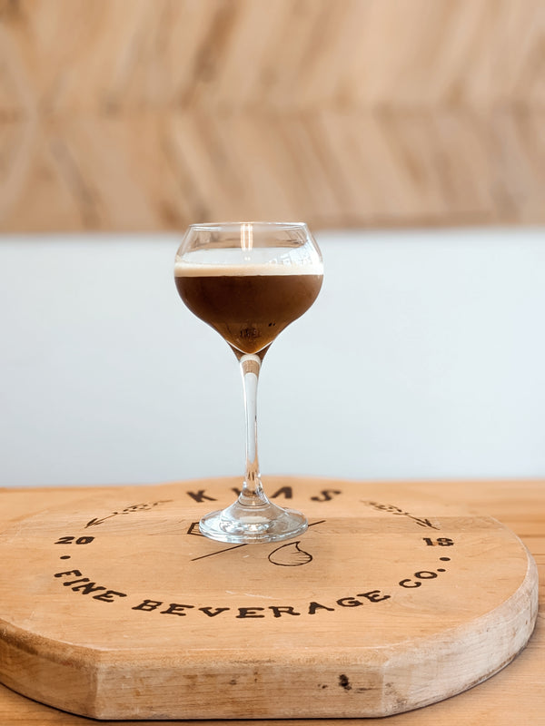 Pumpkin Spice Espresso Martini made with Kvas Old Fashioned Simple Syrup on Kvas Fine Beverage wooden board