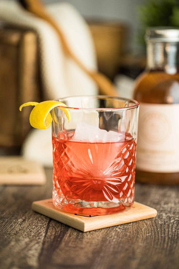 Closeup of Kvas Negroni cocktail made with Kvas Cranberry Rosemary Syrup