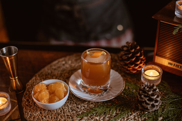 Close up lifestyle shot of Clementine Old Fashioned cocktail made with Kvas Northern Maple Old Fashioned Simple Syrup