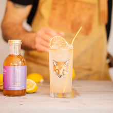 Load image into Gallery viewer, Craft cocktail garnished with oranges in special &quot;Fox&quot; glass next to bottle of Kvas Lavender Jasmine Simple Syrup
