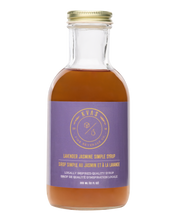 Load image into Gallery viewer, Closeup of Kvas Lavender Jasmine Simple Syrup bottle on transparent background