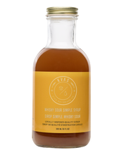 Load image into Gallery viewer, Closeup shot of Kvas Whisky Sour Simple Syrup bottle on transparent background