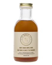 Load image into Gallery viewer, Closeup shot of Kvas Honey Ginger Simple Syrup bottle on transparent background