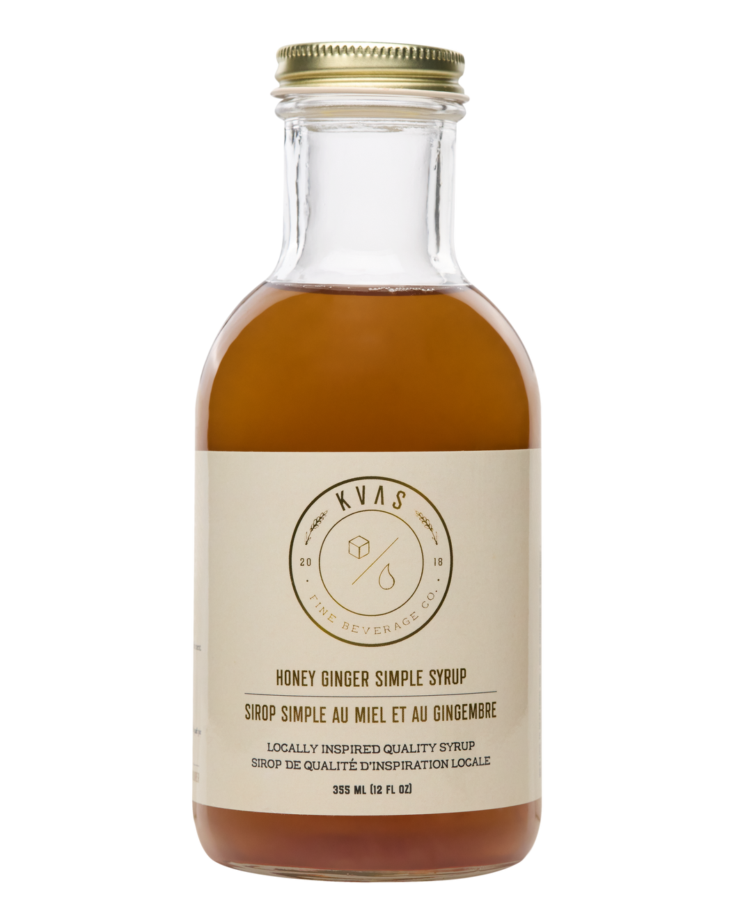 Closeup shot of Kvas Honey Ginger Simple Syrup bottle on transparent background