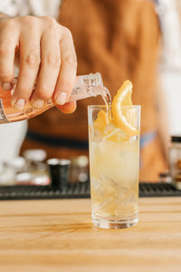 Lavender Tonic cocktail being poured by bartender