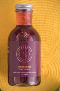 Closeup of Kvas Cherry Hibiscus Simple Syrup bottle